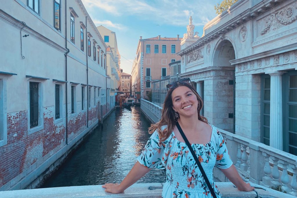 Savannah Josey, a business analytics major, stands in front of a canal in Spain.
