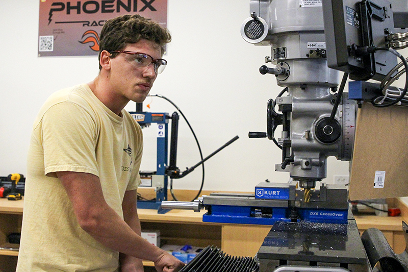 Nick Muller works on an FSAE machine in Founder's Hall.