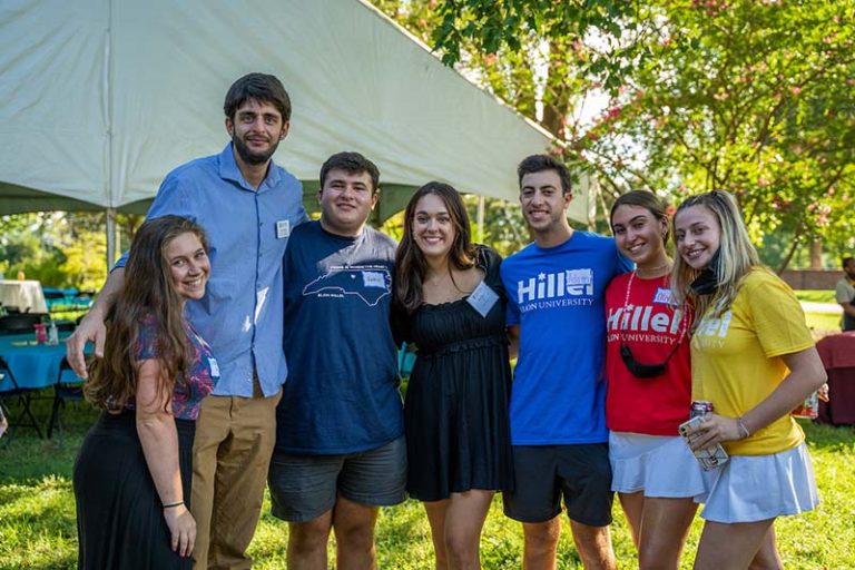Members of Elon Hillel gather together in their Hillel shirts.