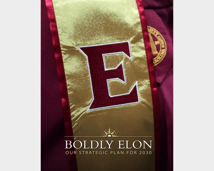 Cover image of a brochure with the words 'Boldly Elon Our Strategic Plan for 2030' over a close up image of gold commencement stole with a maroon E on it.