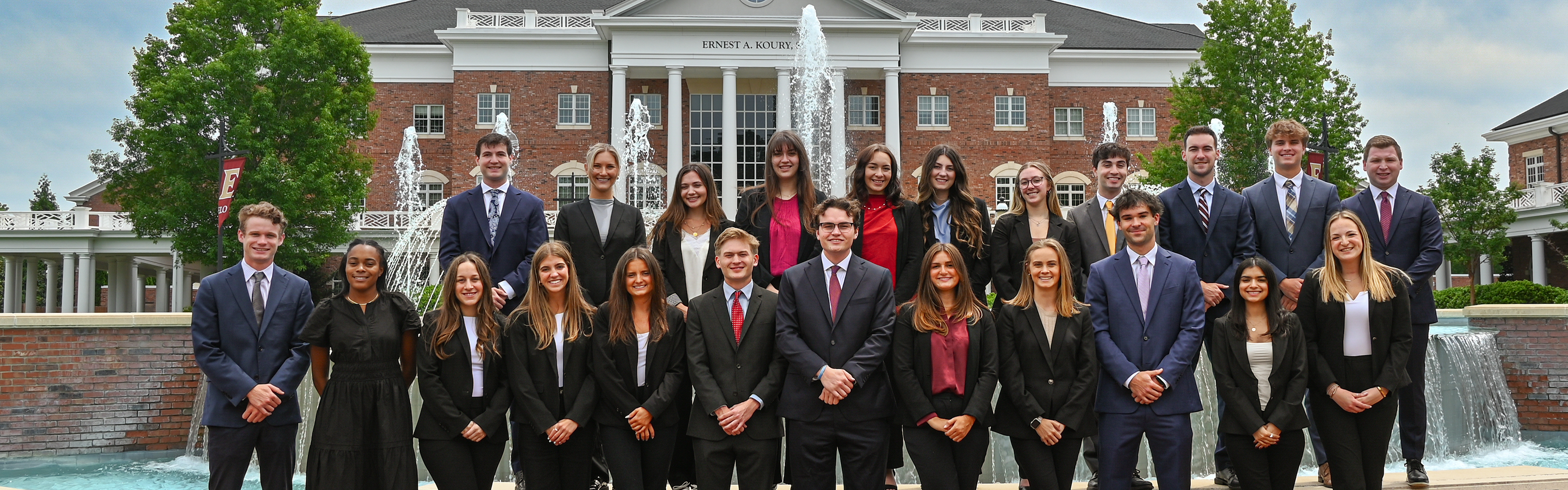 Class of 2025 Business Fellows at the Chandler Fountain in front of Koury Business Center