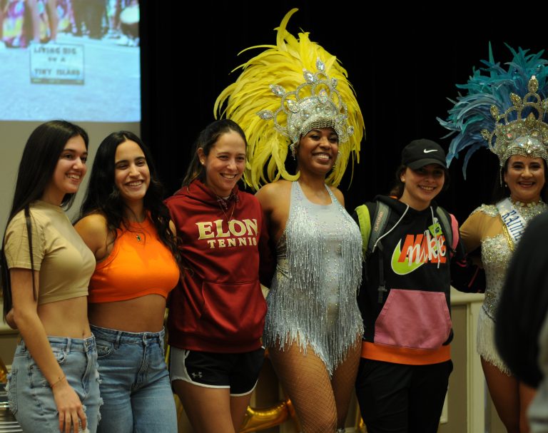 group of students posing with dancer