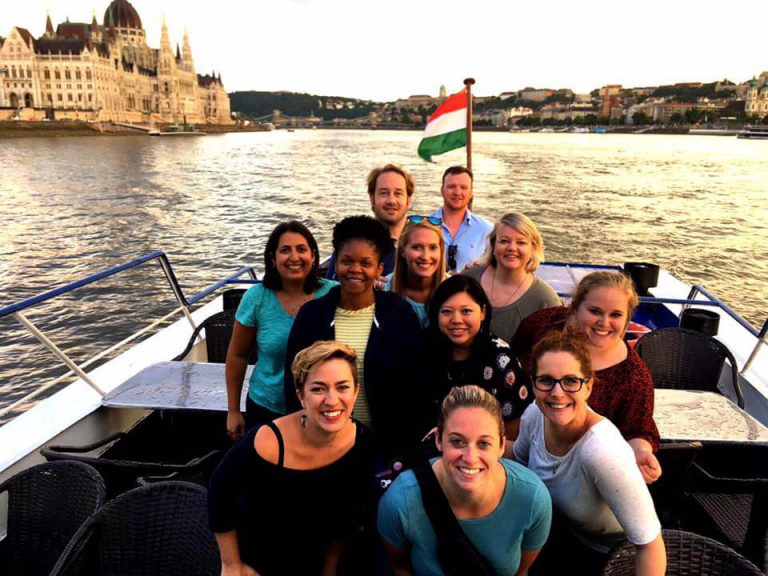 Elon mba program students on a boat during study away trip