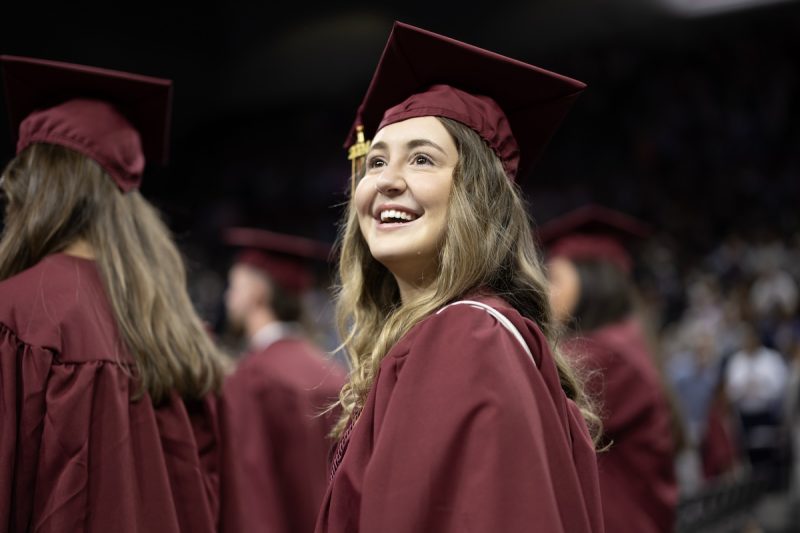 Picture of student at undergraduate commencement in cap and gown