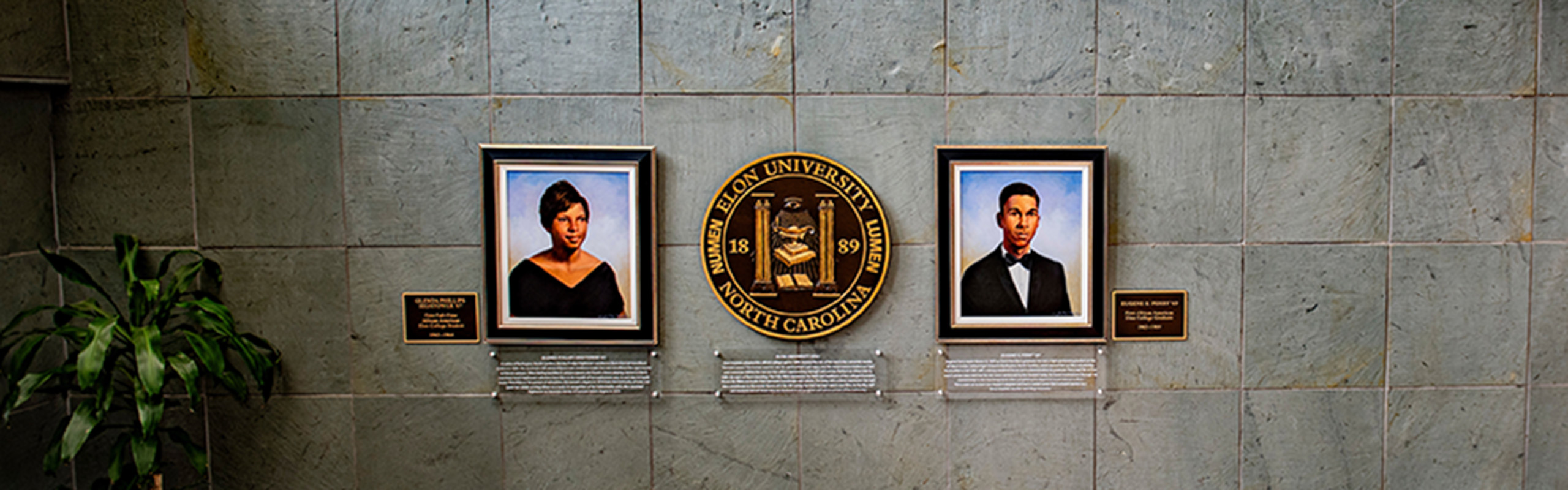 Portraits of Glenda Phillips Hightower, who was Elon’s first full-time Black student, and Eugene E. Perry ’69, Elon’s first Black graduate, hang in the lobby of the Moseley Center at Elon University