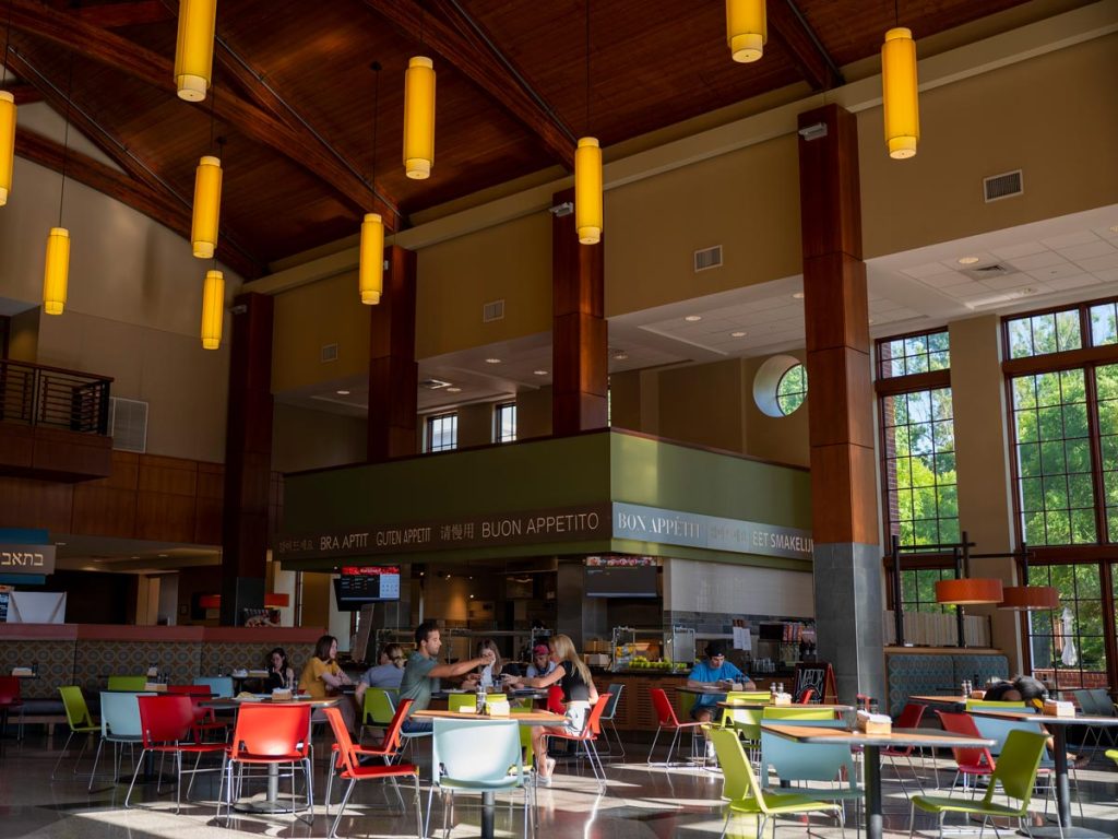Interior view of a large, modern dining hall on Elon's campus.