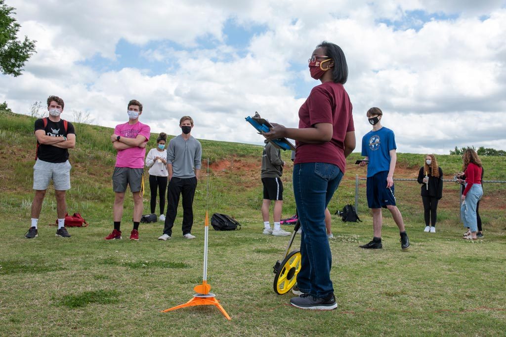 A group of Elon Engineering students gather to launch rockets that they built.