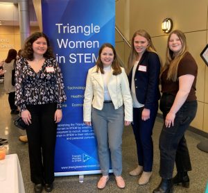 Four Elon Women in STEM members at a Triangle Women in STEM event