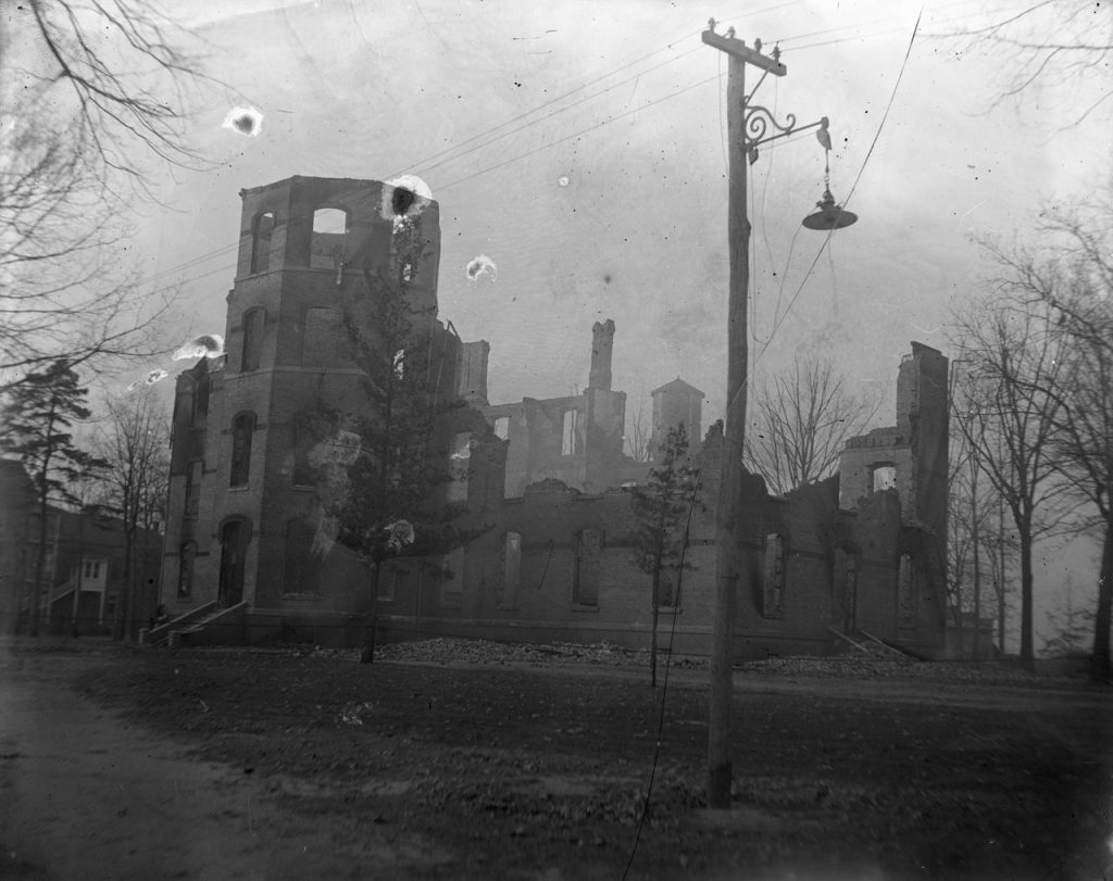 Black and white scan of a historic photograph of the Elon College Administration Building after a fire destroyed it in the early morning hours of January 18, 1923.