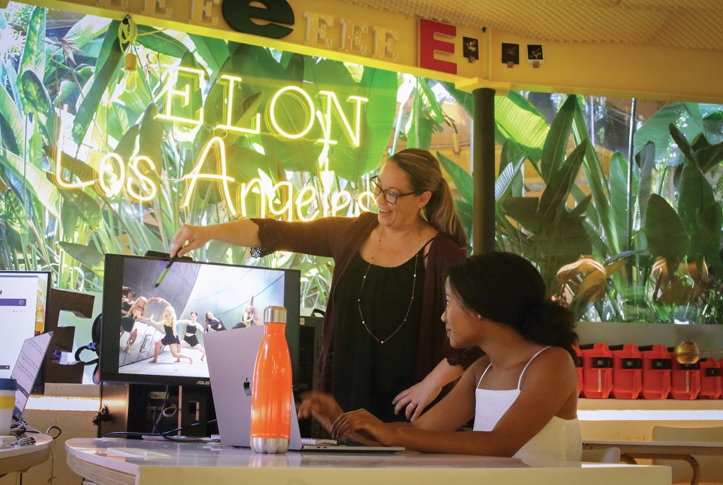 A professor works with a student in the Elon in Los Angeles space that allows for collaboration between students, local professionals and alumni