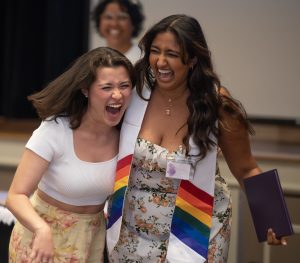 Sujaya Sunkara ’23, right, and … share a laugh at the Lavender Graduation, May 5, 2023, in McKinnon Hall on the campus of Elon University.