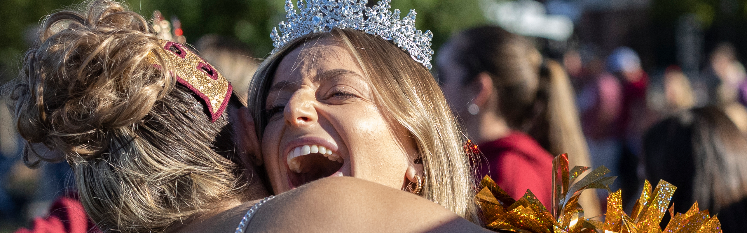 Homecoming Royalty hugging friend, homecoming 2023.