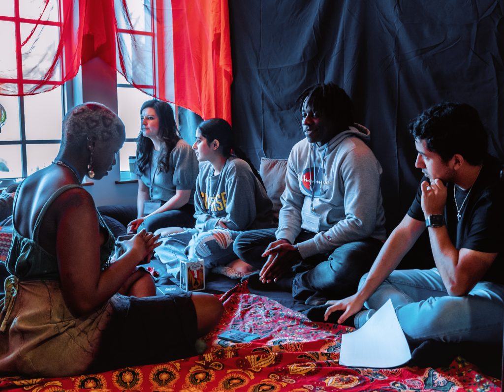 Students in the space called the "Red Tent" at the Ripple Interfaith Conference