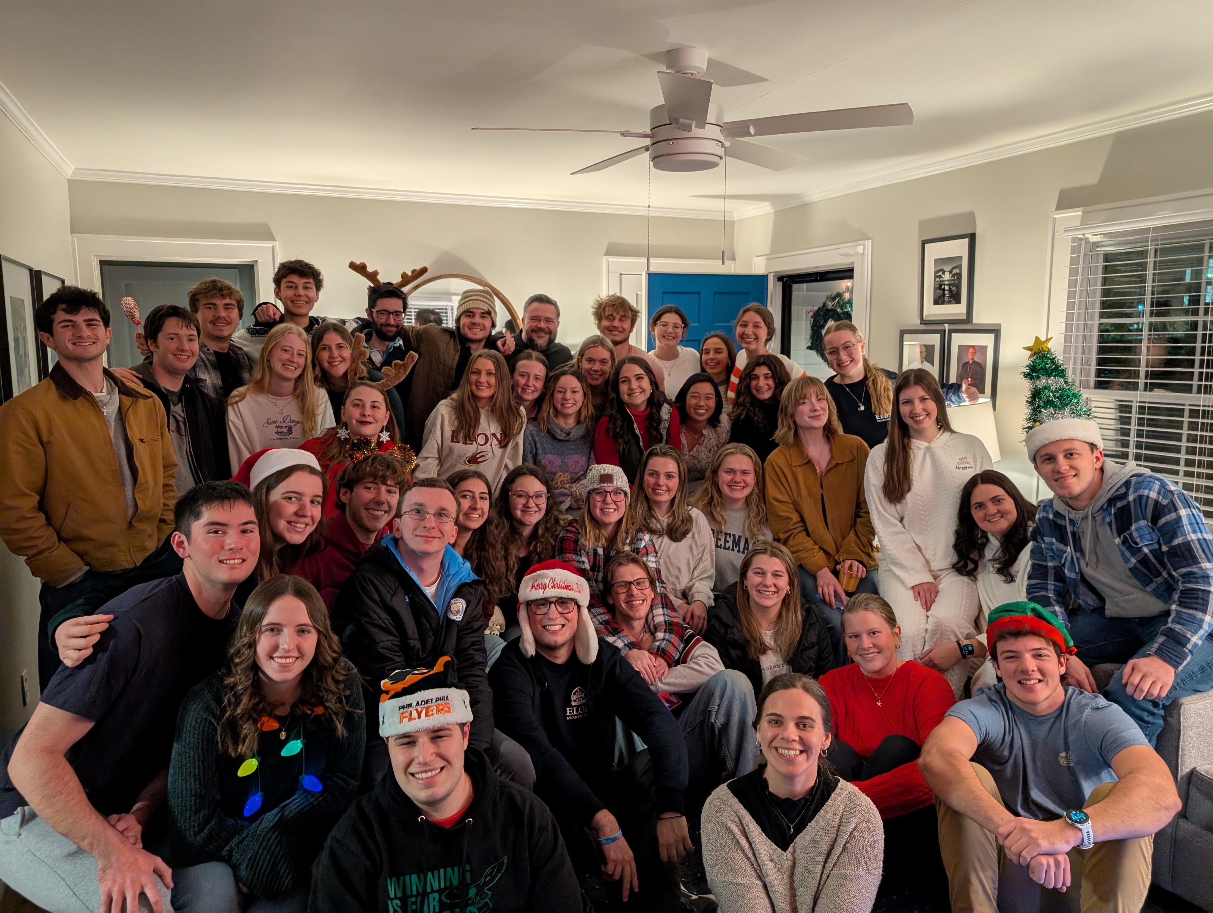 Students celebrating the holidays with a festive party in the CCM House.