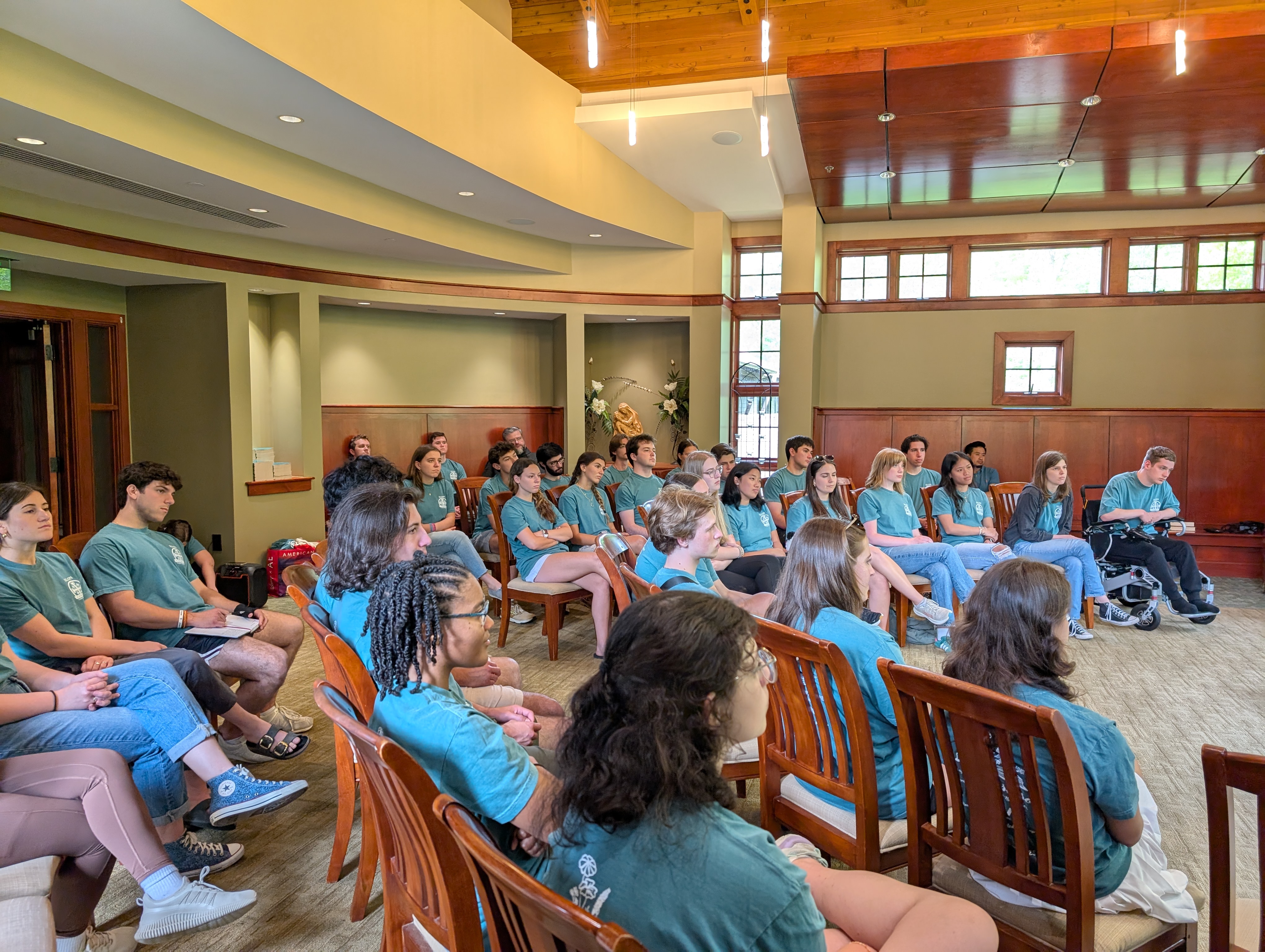 CCM students listening to a speaker during a retreat.