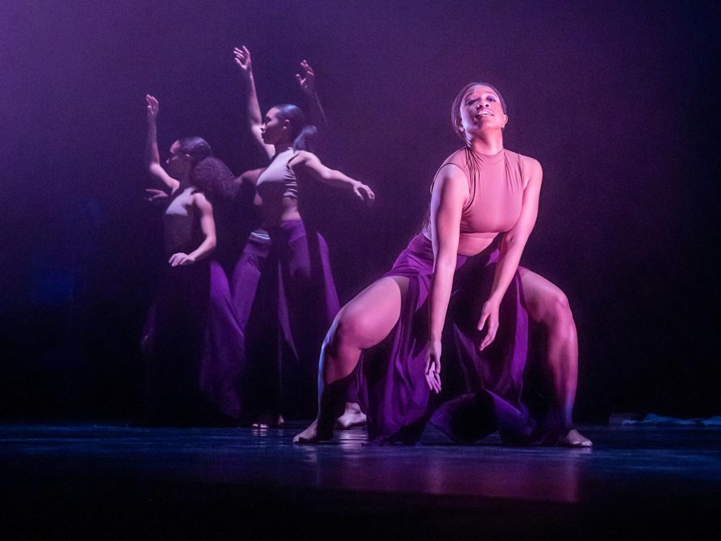 Dancers perform on stage during a Black History Month Dance Concert.