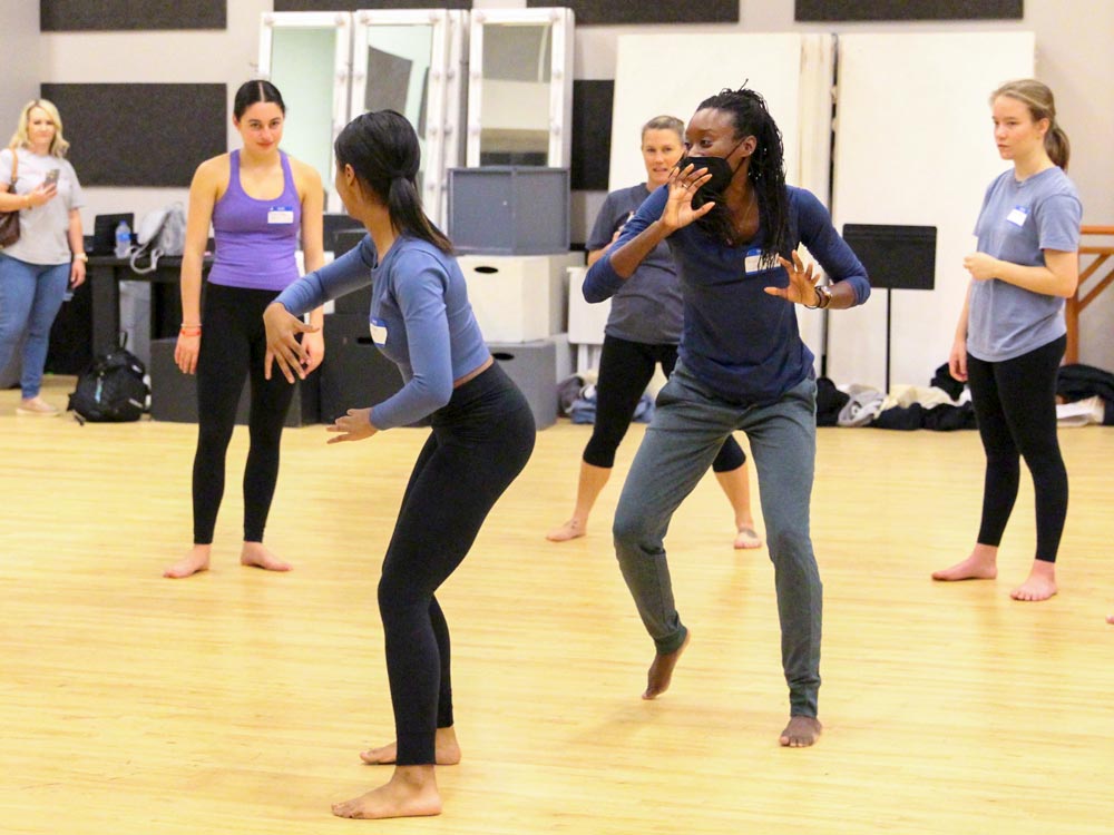 Lecturer in Dance Jasmine Powell, positioned second from the right, guides an introduction to capoeira, a Brazilian dance form, for high school students participating in Discover Dance with Elon.