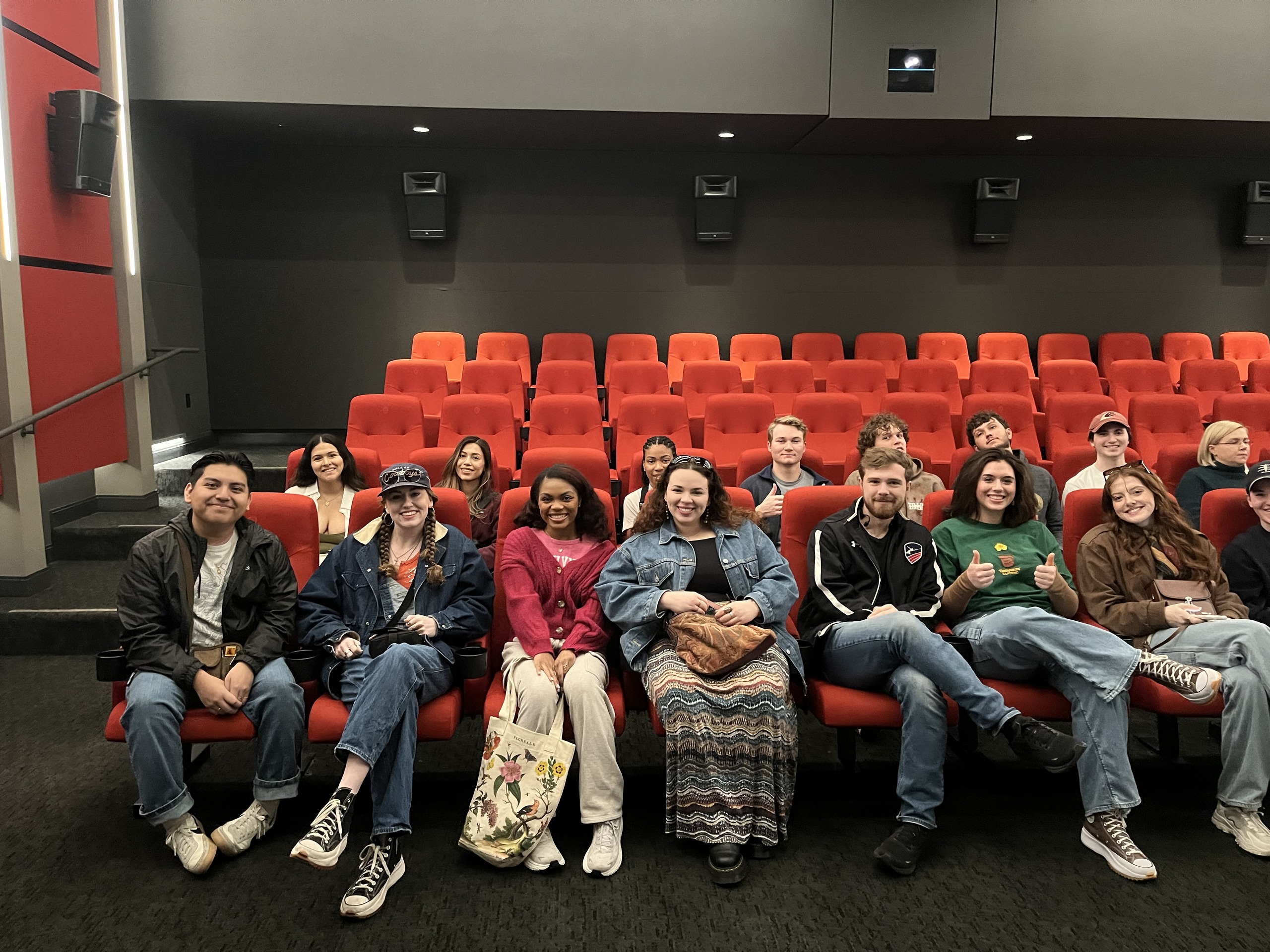Students group photo in a theater