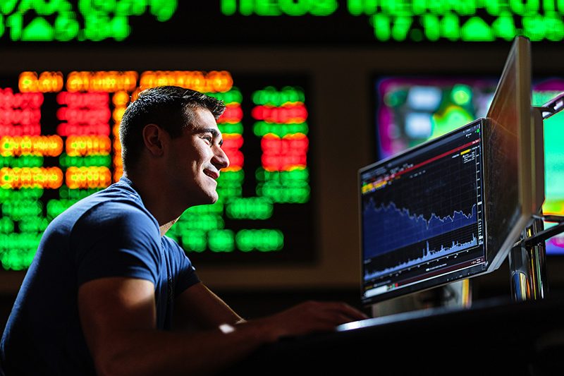 Elon MBA student looking analyzing data