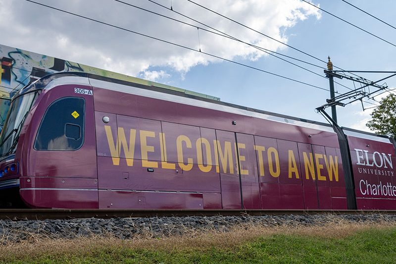 Charlotte public transportation train with Elon branding