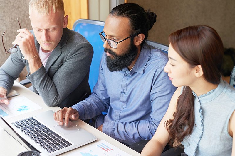 group of students in front of a computer
