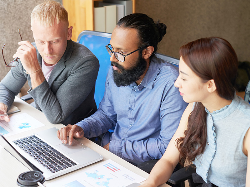 group of students in front of a computer
