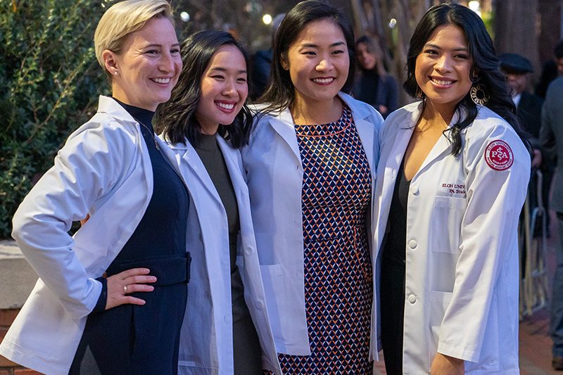 Elon PA students in a group with their white coats