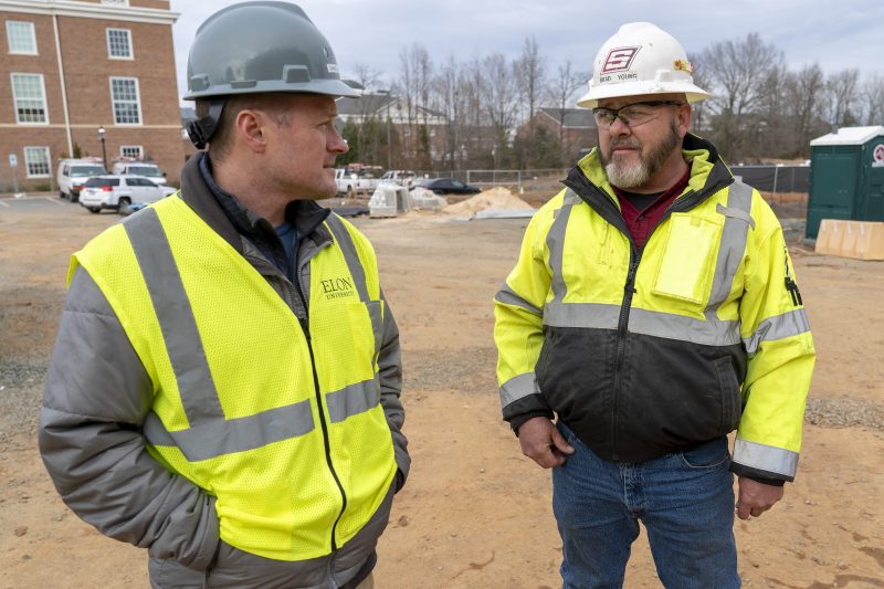 Daniel Carper, Elon University Director for Construction Management, left, chats with Brad Young, Sr. MEP Manager at Samet Corporation, at the site of Founders Hall and IQ2 construction
