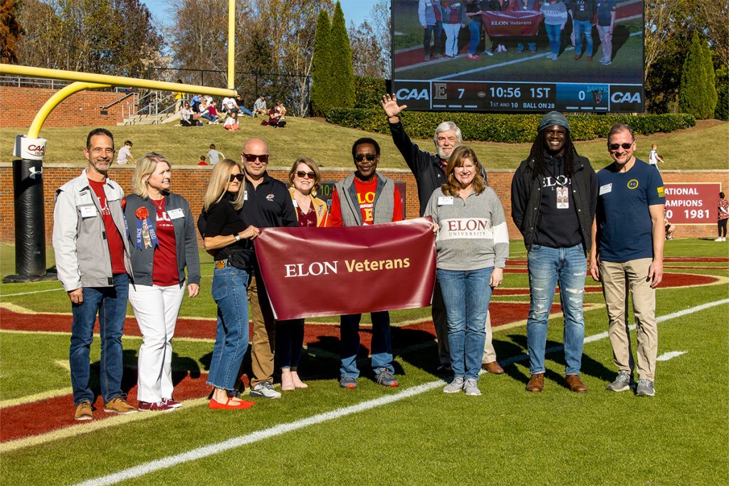Members of the Veteran's Employee Resource Group are recognized on the football field