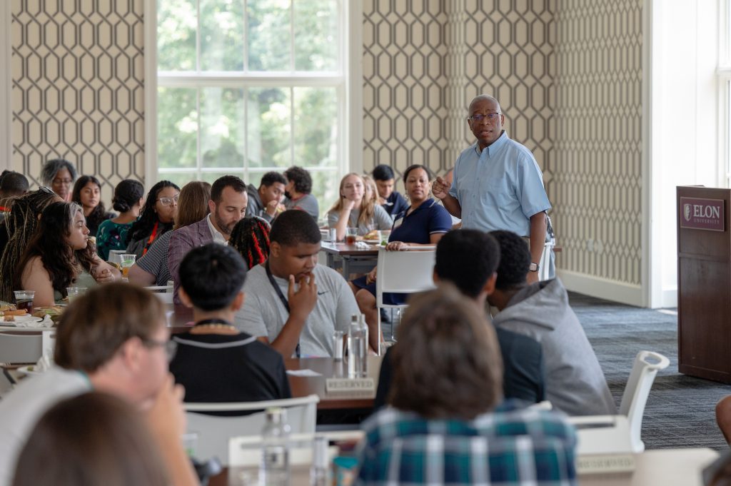 A photo of Assistant Professor George Talbert speaking to Odyssey Program scholars from the Class of 2028