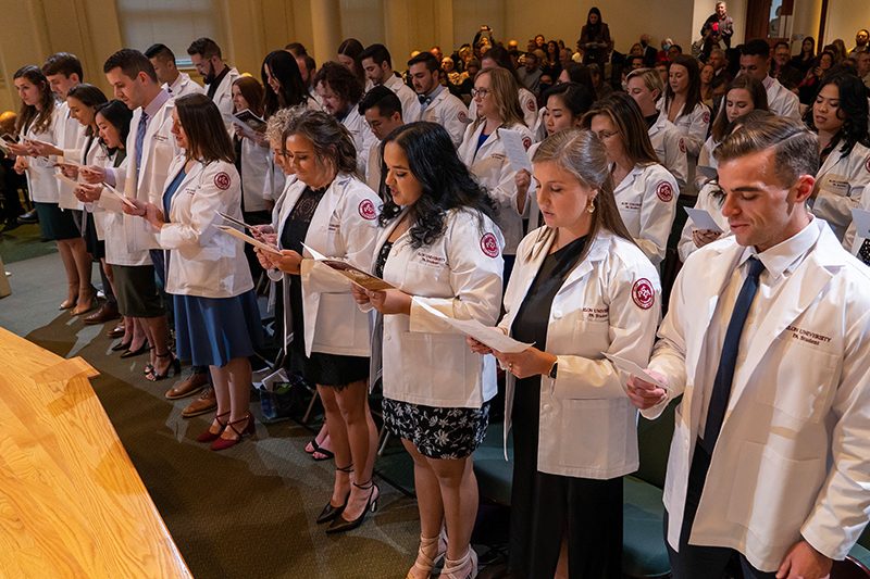 elon school of health science students in white coats