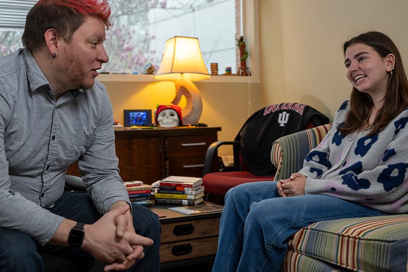 two elon graduate students in conversation