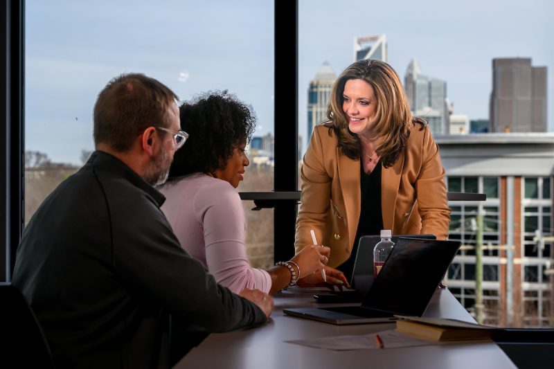 Elon University faculty and two students on the charlotte campus