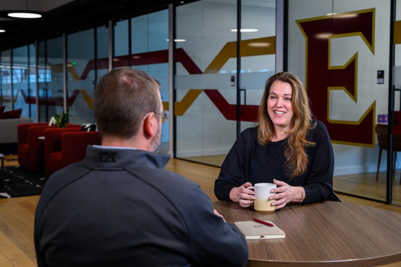 A faculty and student talking