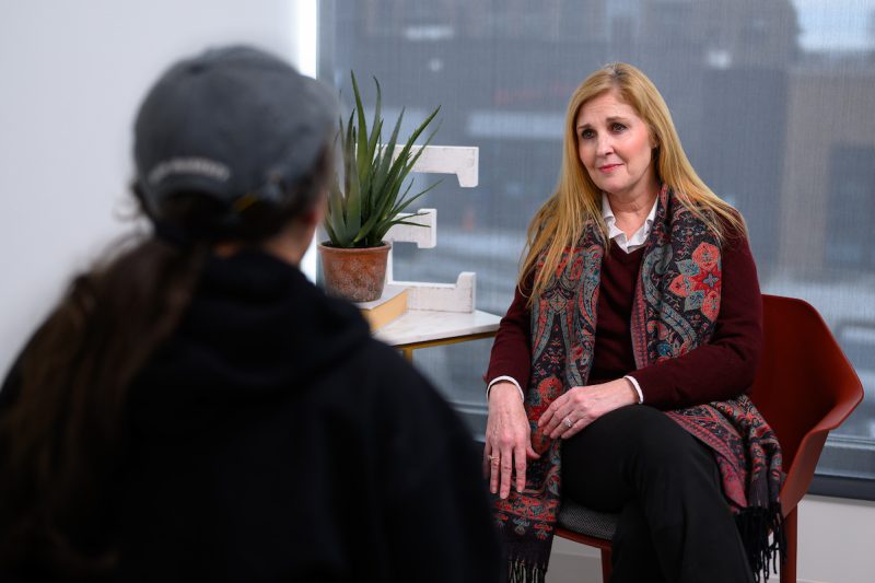 Judy Folmar, Elon CMHC program faculty member talking to a student