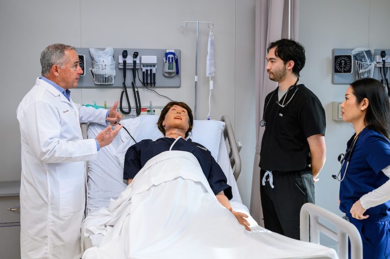 Elon PA students and faculty in a simulation lab