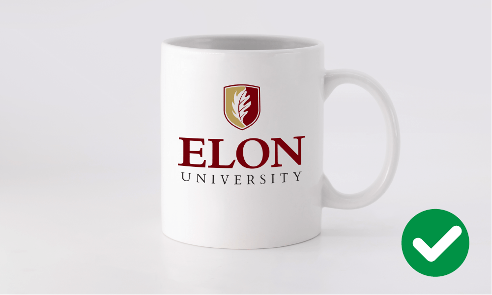 Correct Elon University logo placement on a white mug.