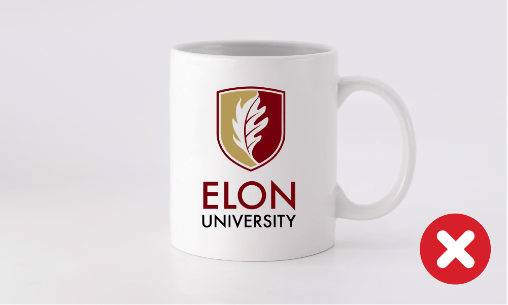 Incorrect Elon University logo placement on a white mug.