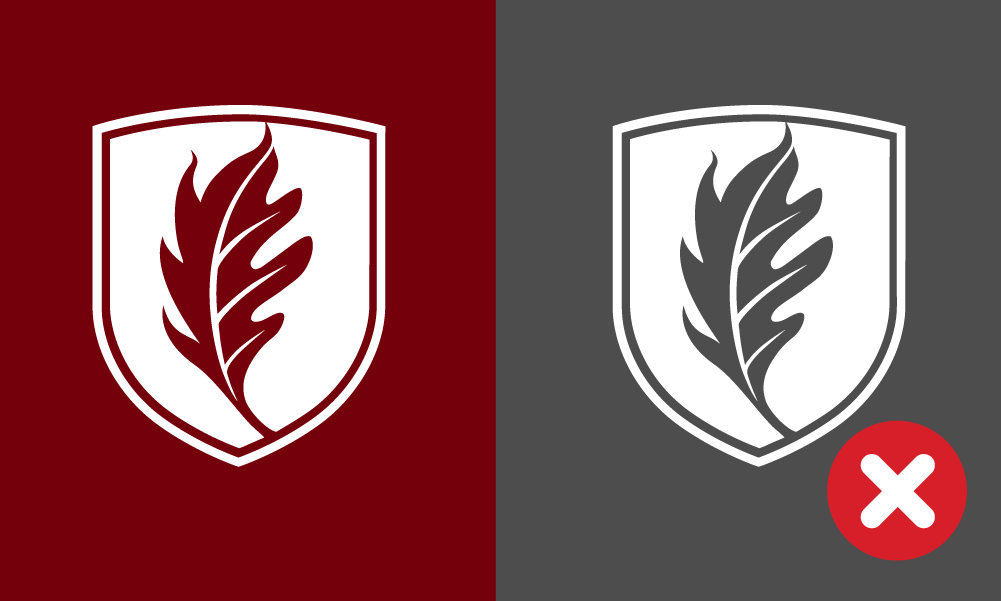 Incorrect one-color applications of the Elon University shield.