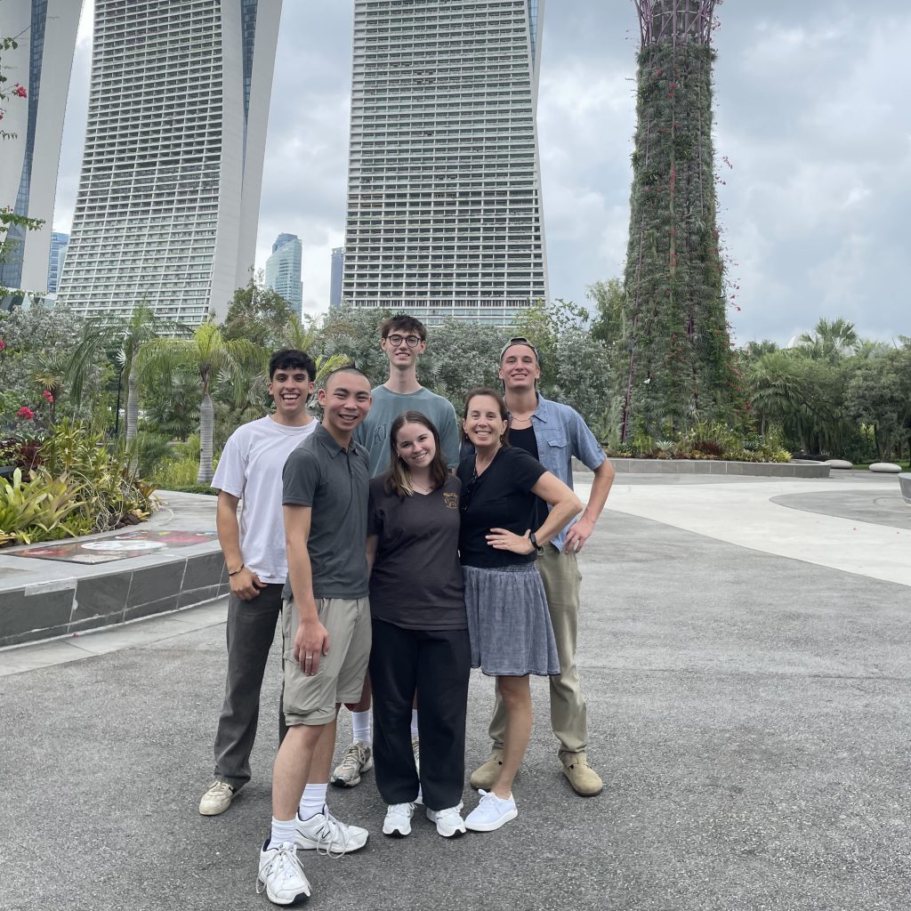 Beth McCain with students on first day in Singapore
