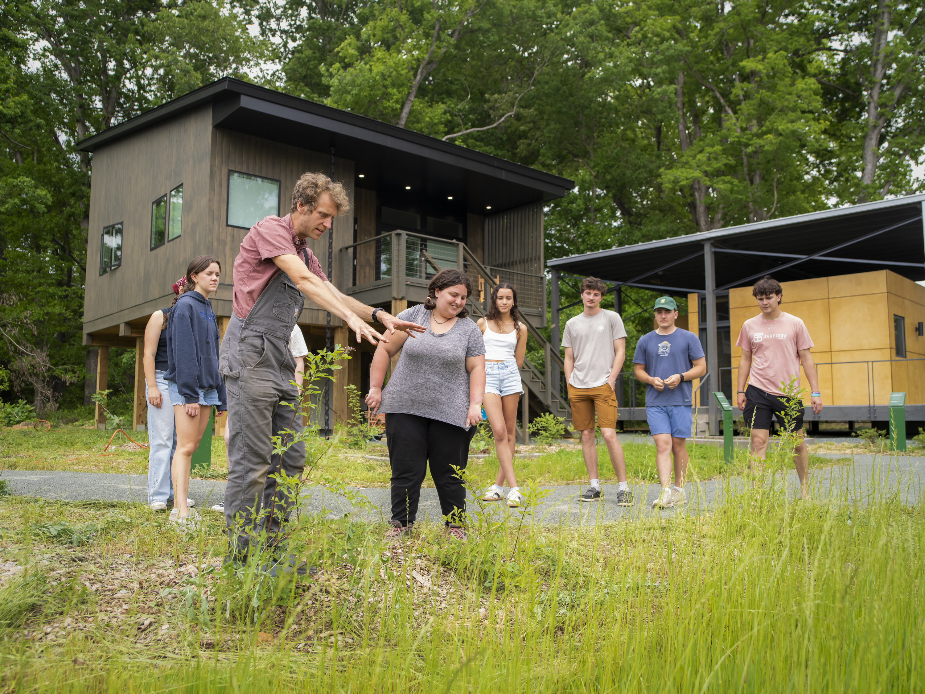 Jacob Rutz, Assistant Teaching Professor of Environmental Studies, in a field with students