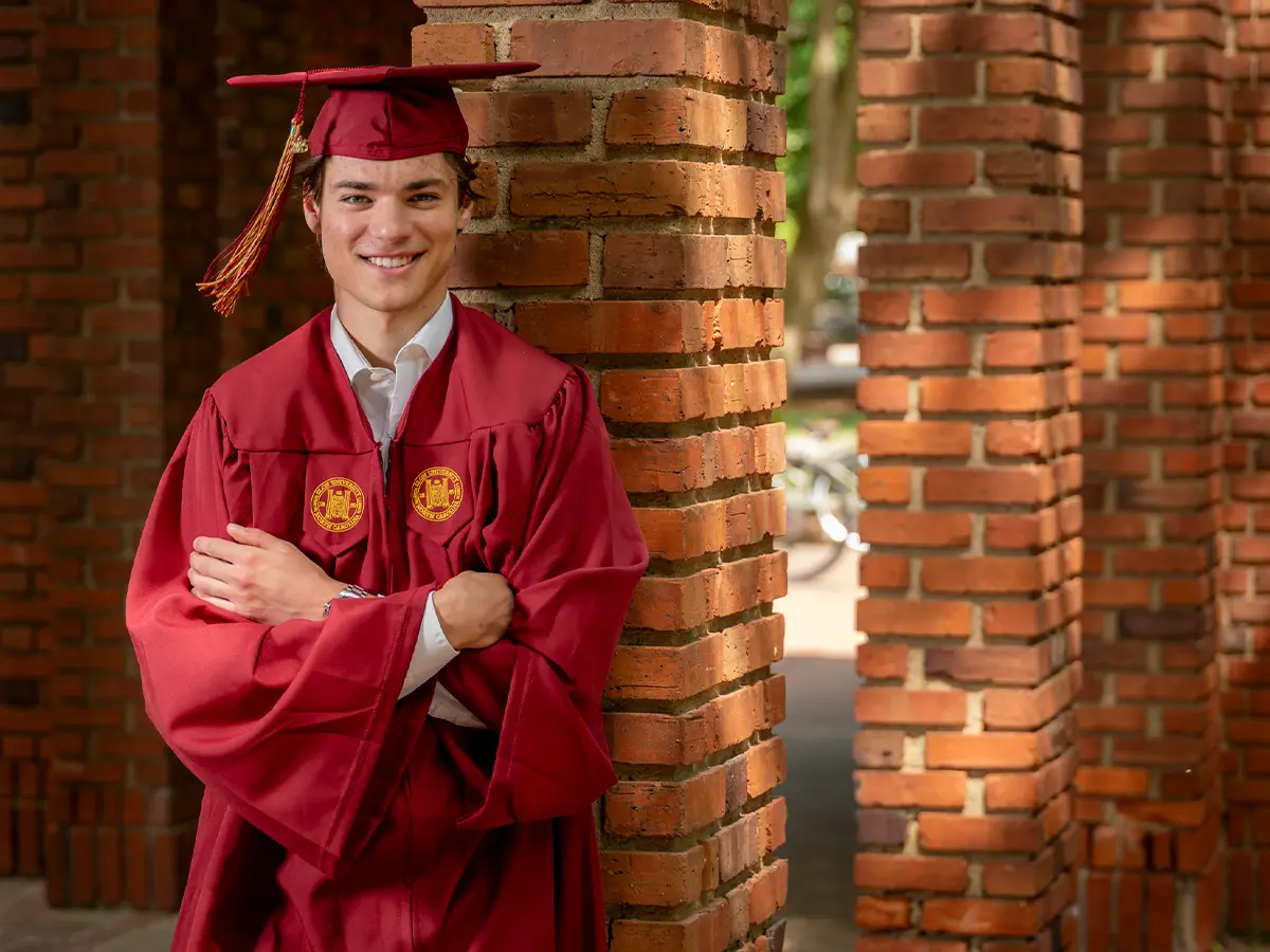 Man in a graduation cap and gown