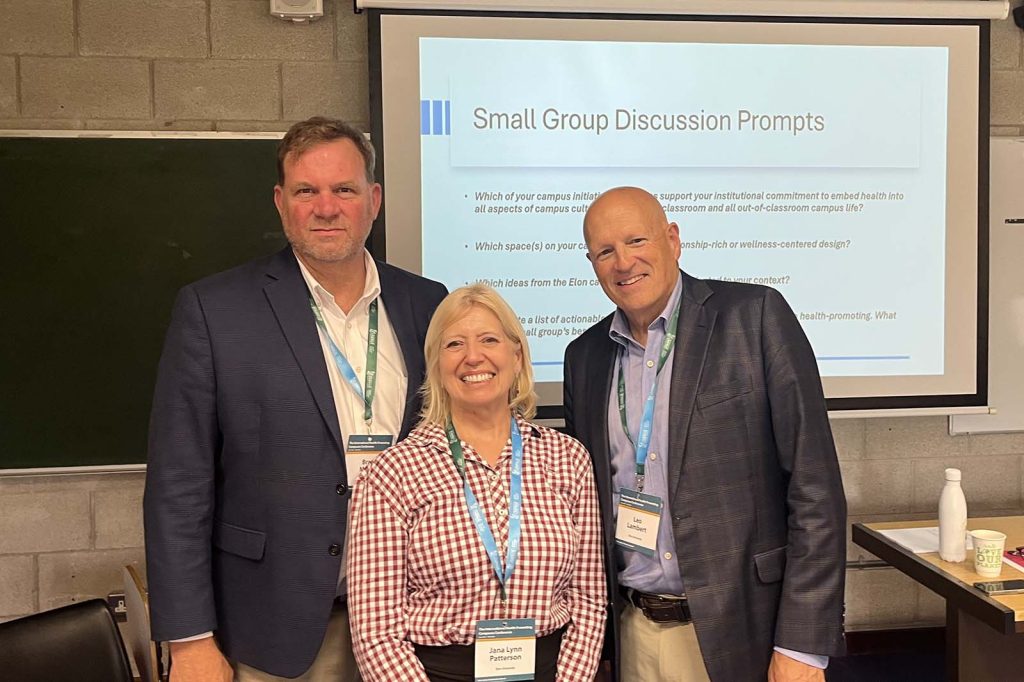 Brad Moore, associate vice president for facilities and university architect; Jana Lynn Patterson, associate vice president for student life and dean of student health and well-being; and Leo Lambert, professor of education and president emeritus posing for photo before presentation at conference