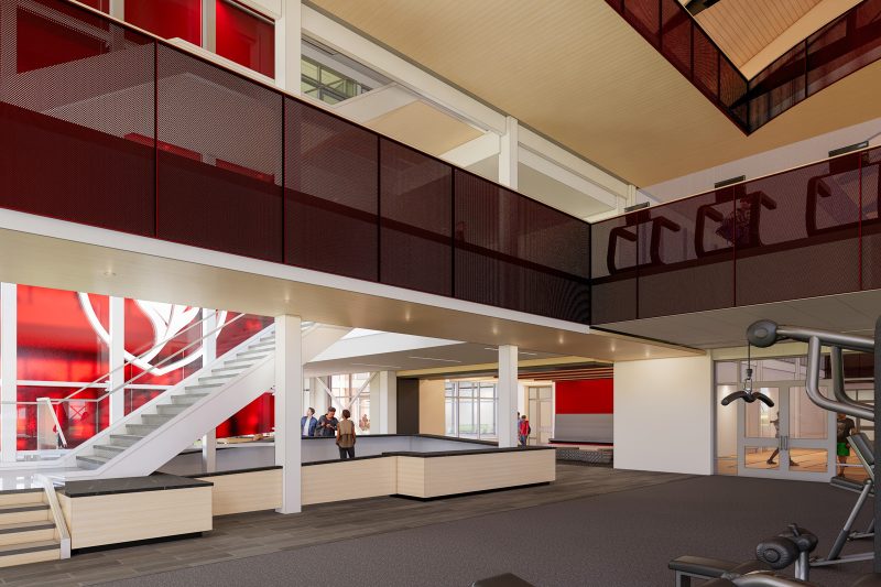 Architectural rendering within the Slattery Center of the multi-level atrium with red accents, an open staircase, mezzanine walkway, and fitness equipment visible on the right