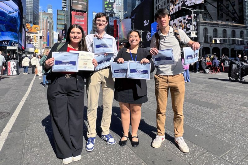 Elon News Network students stand in New York's Times Square.