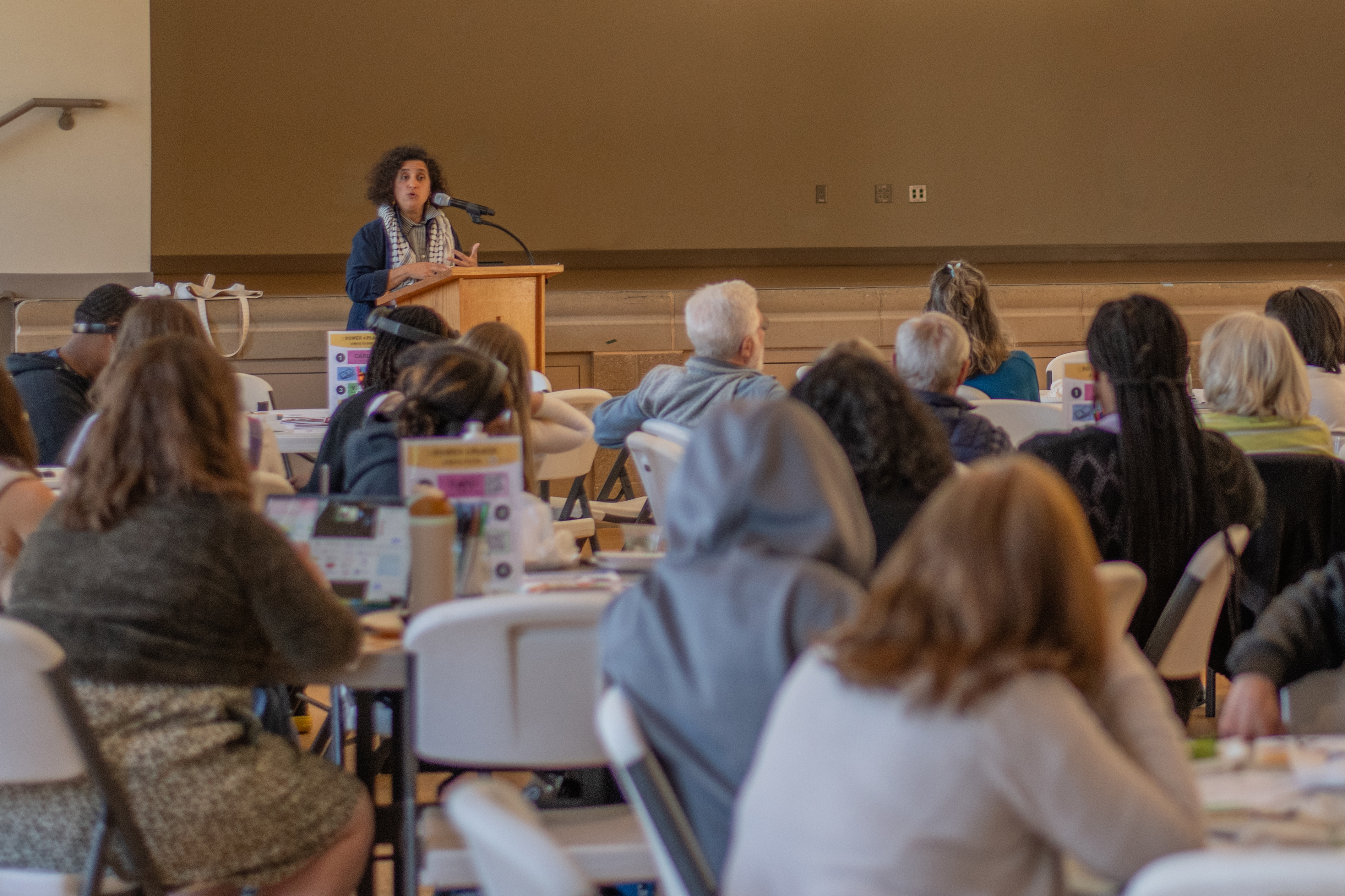 design forge and power and place presenter diya abdo speaking to workshop participants at the elon community church