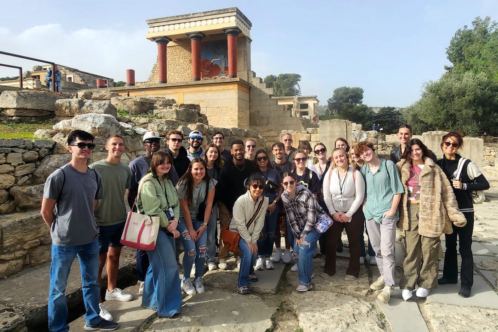 director of design thinking danielle lake poses with students in the winter term class in greece