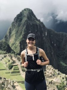 India Kirssin posing in front of mountain. 