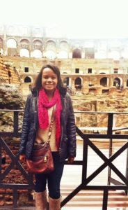 Sarah Morrison standing in front of the coliseum in Rome, Italy. 