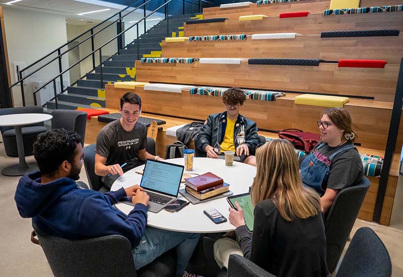 Students discuss classwork while sitting in a common area of Founders Hall October 11, 2022.